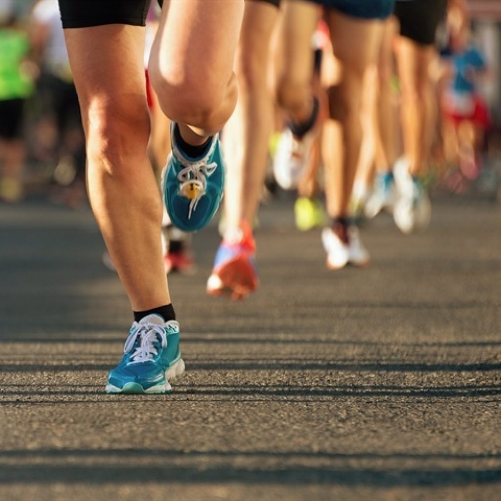 A shot of legs running on the road