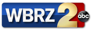 WBRZ 2 ABC logo on a colored background.